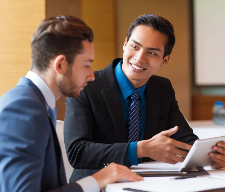 Two smiling business people